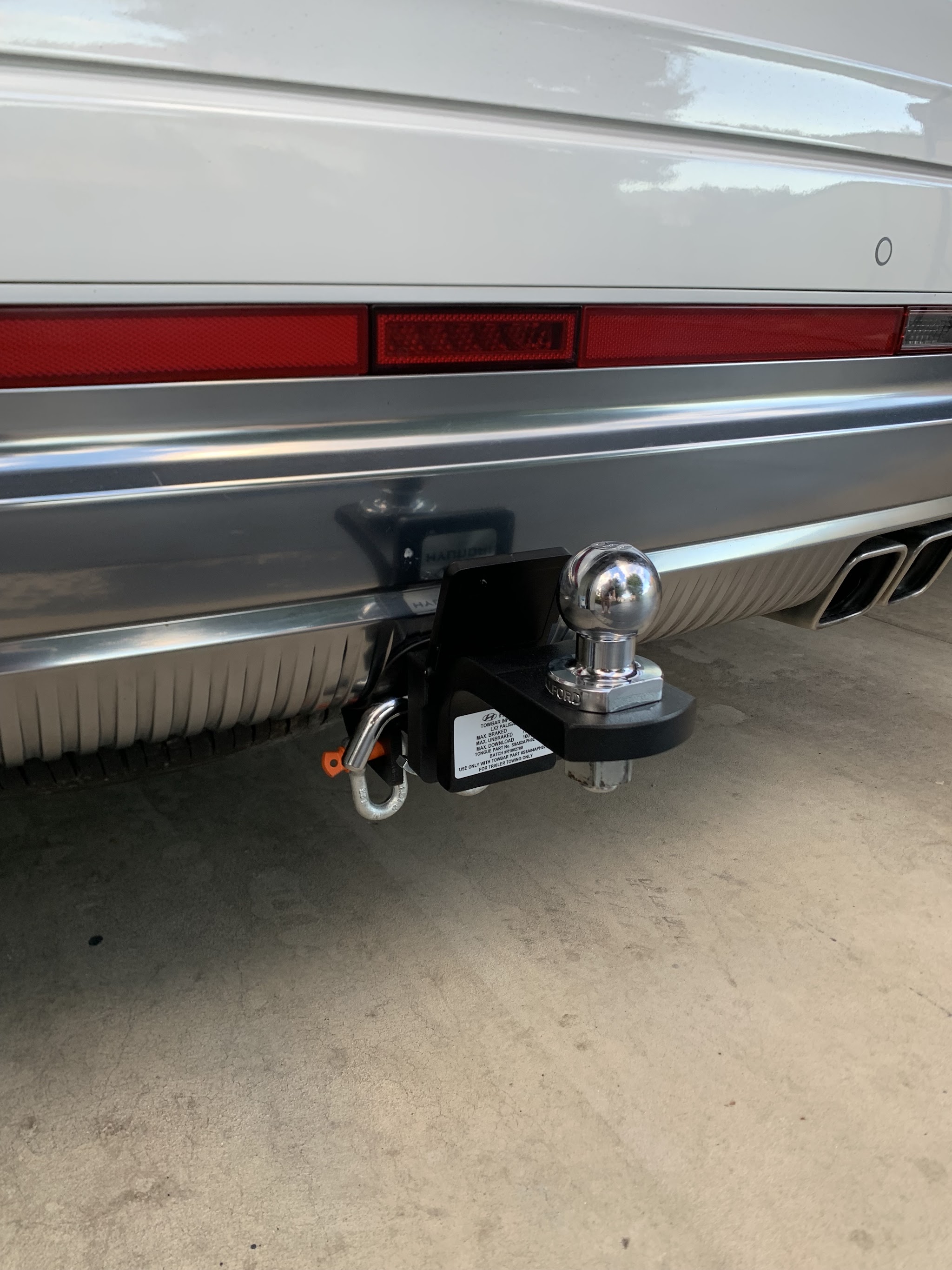 A towbar and tow ball fitted to the rear of a vehicle